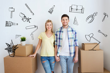 smiling couple with big boxes moving to new home