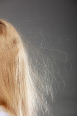 Closeup of woman with static blonde hair.