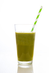 Healthy green detox in glass on white background
