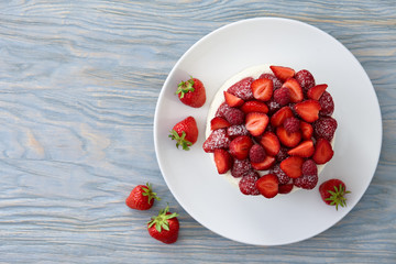 Berry cake on blue background