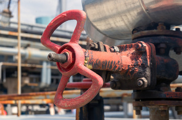 Faucet with steel pipes in natural gas processing plant in summer day