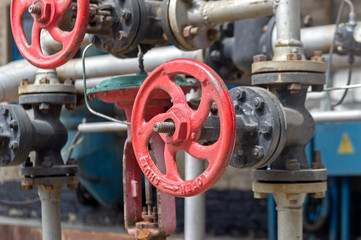 Faucet with steel pipes in natural gas processing plant in summer day
