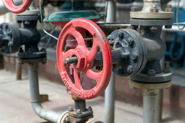 Faucet with steel pipes in natural gas processing plant in summer day