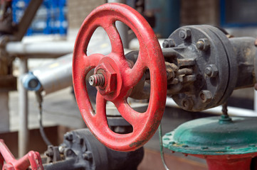 Faucet with steel pipes in natural gas processing plant in summer day