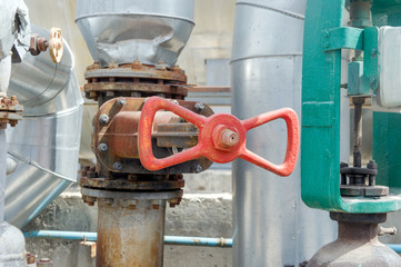 Faucet with steel pipes in natural gas processing plant in summer day