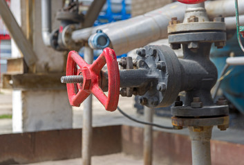 Faucet with steel pipes in natural gas processing plant in summer day