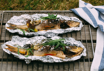 roasted seabass in a dish on wooden table 