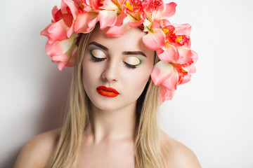 Portrait of a beautiful girl in a flower wreath