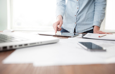 Website developers working using  laptop at the office on wooden