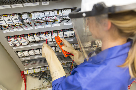 young electrician woman at work