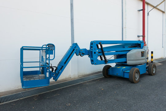 Lifting Boom Lift In Construction Site.