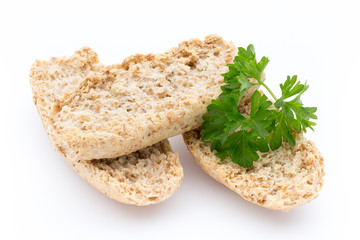 Dry flat bread crisps with herbs on a white background.