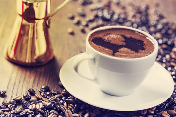 Cup of coffee on wooden table