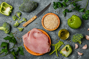 Ingredients for dinner cooking - vegetables, rice and turkey ste