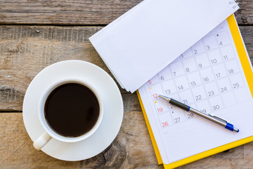 cup of coffee  with paper note on wood table background