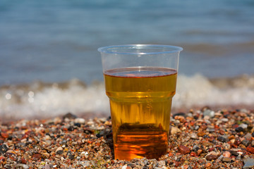 Glass of beer on the sea