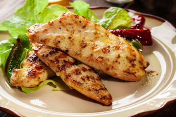Grilled chicken breasts served with grilled paprika