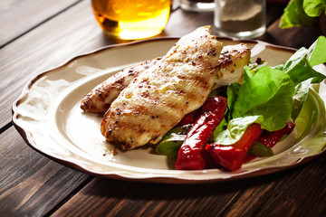 Grilled chicken breasts served with grilled paprika