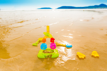 Colorful toys for childrens sandboxes on the sea and the beach