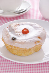 Belgian Bun a fruit cake covered in fondant icing