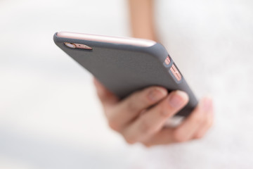 Woman sending sms on cellphone
