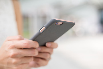 Woman watching on mobile phone