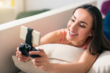 Nice smiling  woman resting on the couch 