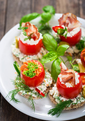 Canapes with stuffed cherry tomatoes 