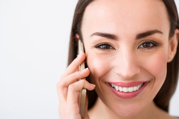 Overjoyed woman  talking on cellphone 