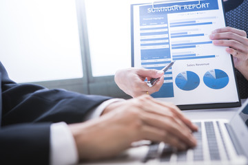 Business adviser analyzing financial figures denoting the progre