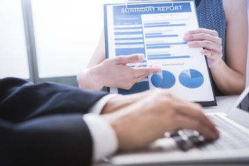 Business adviser analyzing financial figures denoting the progre