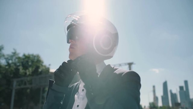 Business man wears a helmet