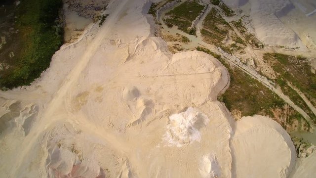 The white powdered quarry area of limestones. These are crushed big limestones processed into powdered form