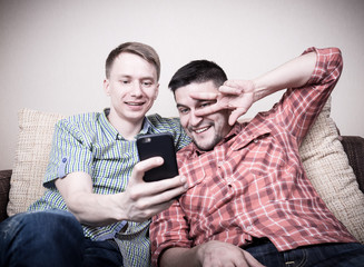 Two guys taking selfie