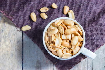 peanuts with salt in white cup