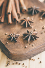 Spice anise, cacao and peper on wooden bacground.