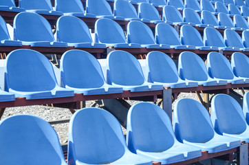 Fototapeta premium Rows of blue plastic seats in the stadium