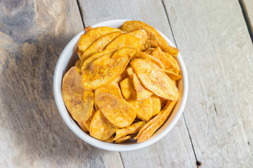 Homemade  Banana Chips  Baked with honey  on wood table