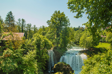      Waterfall on Korana river canyon and beautiful village of Rastoke near Slunj in Croatia 