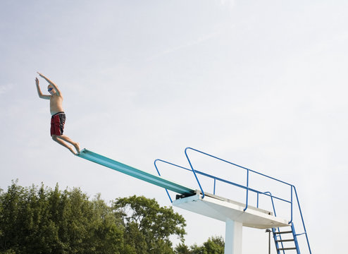A boy on a diving-board.