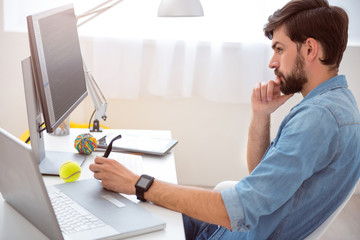 Man thinking in front of computer