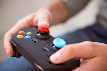 Man playing and holding joystick