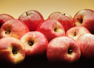red apples on yellow background