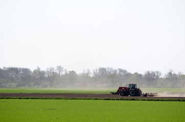 Fototapeta na wymiar Tractor in a dry landscape