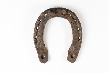 Old rusty horseshoe on a white background