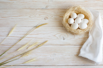 Wooden background with eggs