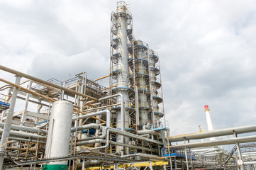Industrial equipment and pipelines at the gas processing plant on a summer day