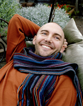 Portrait of a smiling man wearing a scarf, Sweden.