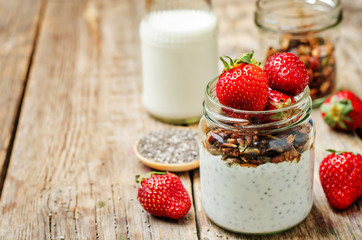 Chia seeds granola Greek yoghurt pudding with strawberries