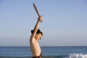 A playing child on the beach.